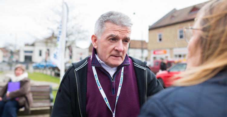 Male Healthwatch volunteer at a community event