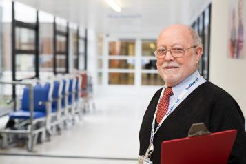 Man stood in a hospital corridor